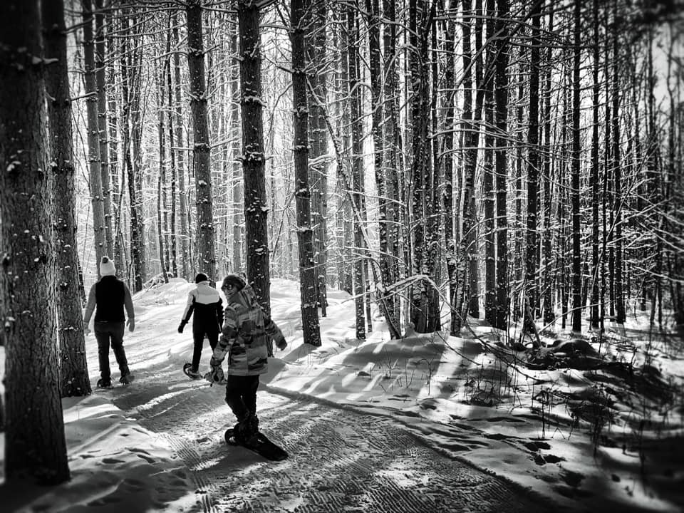 Snowshoers enjoying WinMan at night - black and white photo
