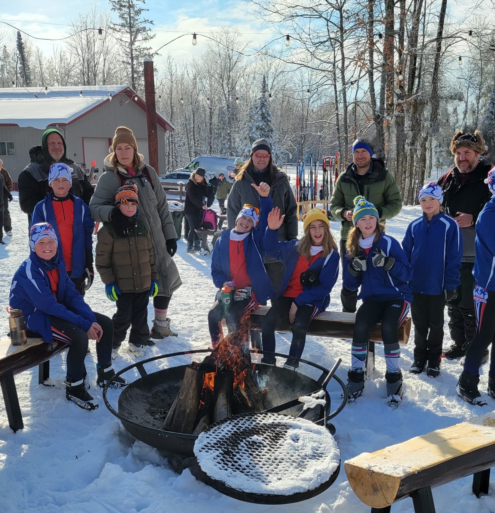 Large group of skiers warming up after a day of skiing