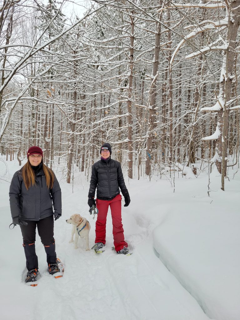 Amanda and Vanessa enjoying the snowshoe trails with Archie