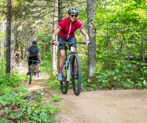 Adults enjoying mountain biking at WinMan