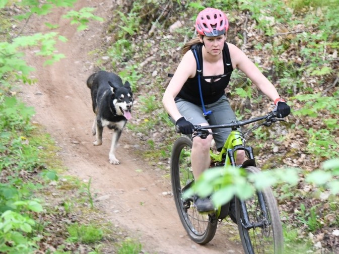 Mountain biking with dog enjoying the trails too