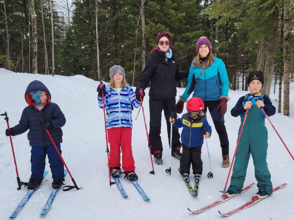 Multiple families getting ready to ski