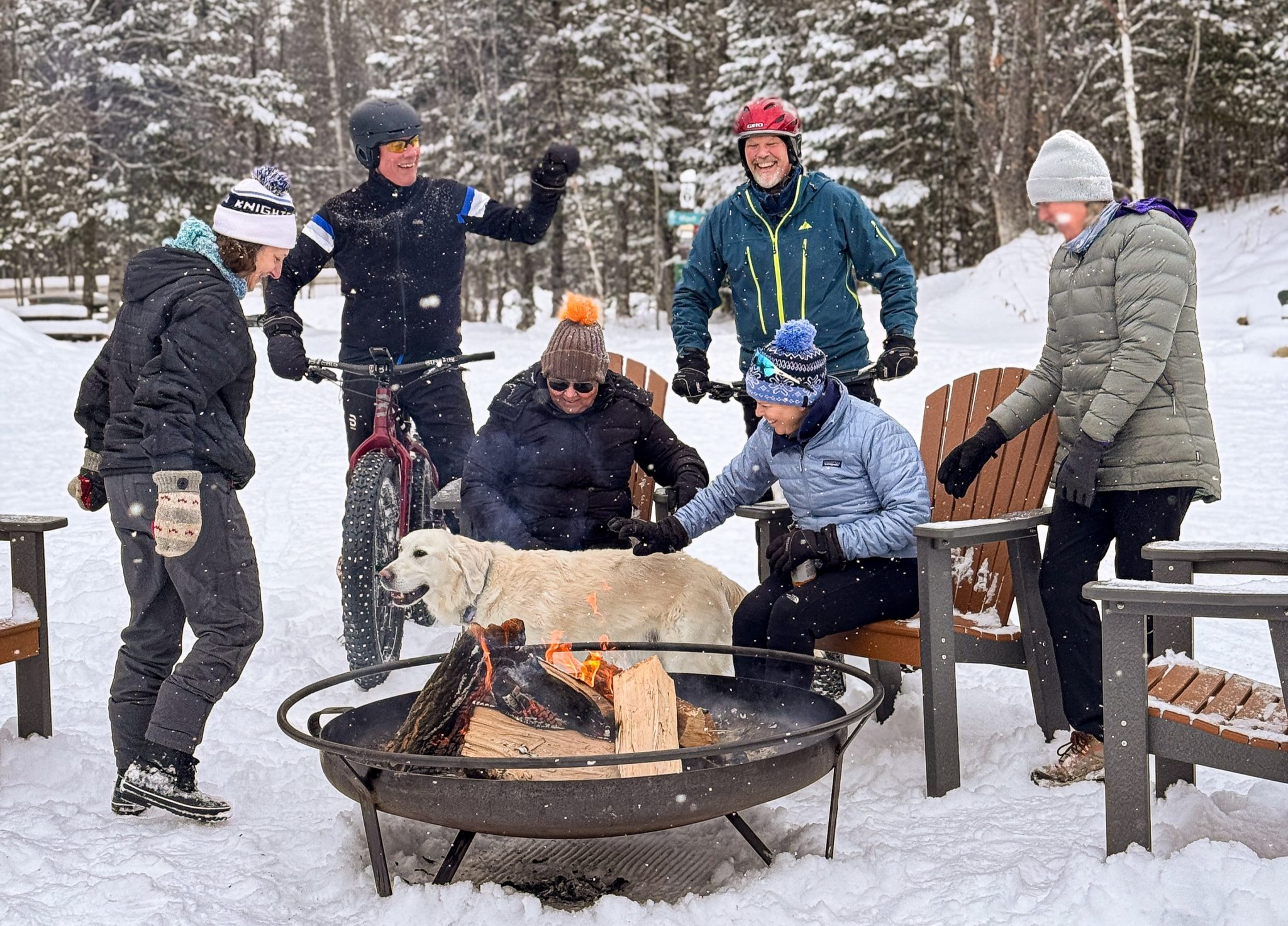 People enjoying a fire at WinMan Park in the Winter
