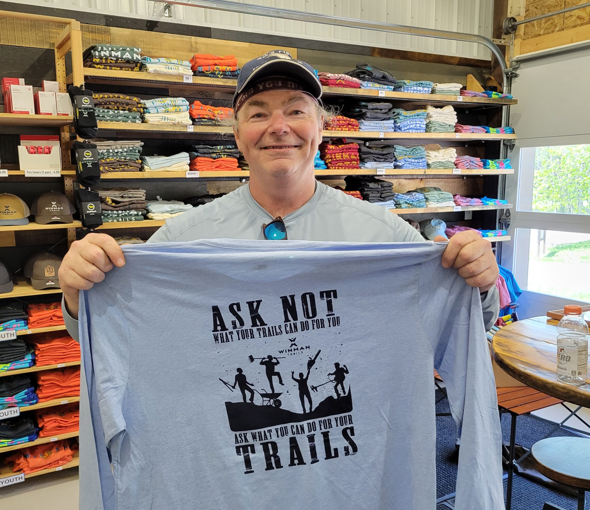 Mike showing the volunteer shirt