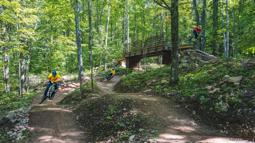 mountain bikers on twins and red trail at WinMan trails