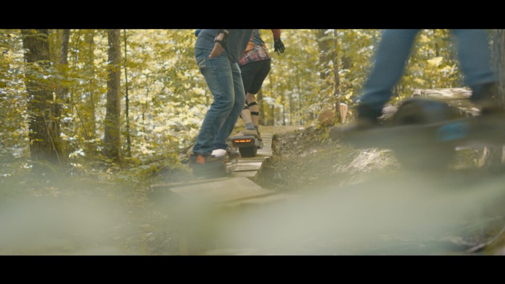 onewheelers on a wooden bridge feature